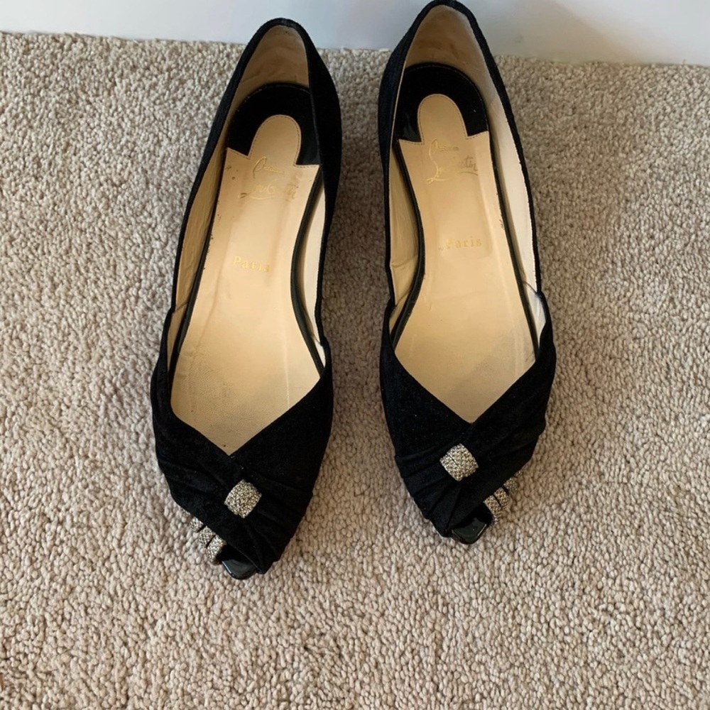 Christian Louboutin pointed flats.